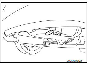 The vehicle rear recovery hook is located in the right rear undercarriage